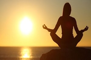 woman-sunset-meditate